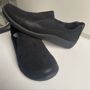 Black Clark’s slip ons